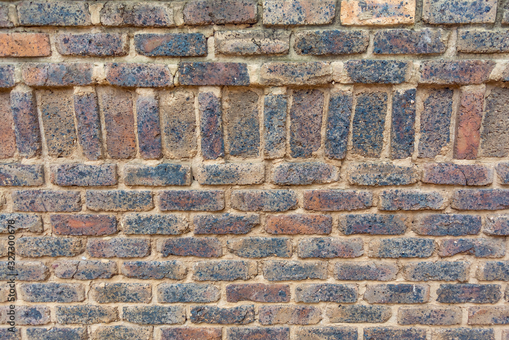 Bricks in brown and yellow colors as a rustic background