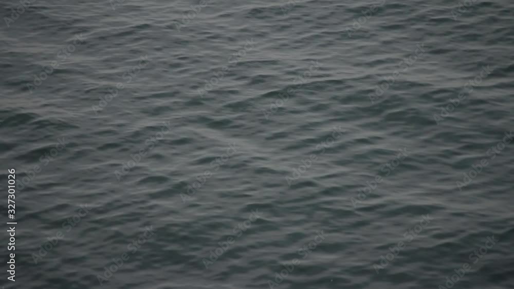 Small waves on the surface of a deep green water. Small waves on the surface of a deep green water.