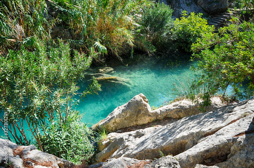 Waterfall with green water pond, Las Fuentes del Algar, Alicante, Spain photo