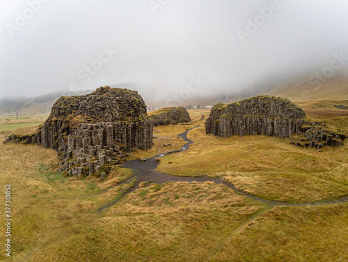 Dverghamrar dwarf hammer natural basalt columns covered in grass and moss landscape in Iceland photo