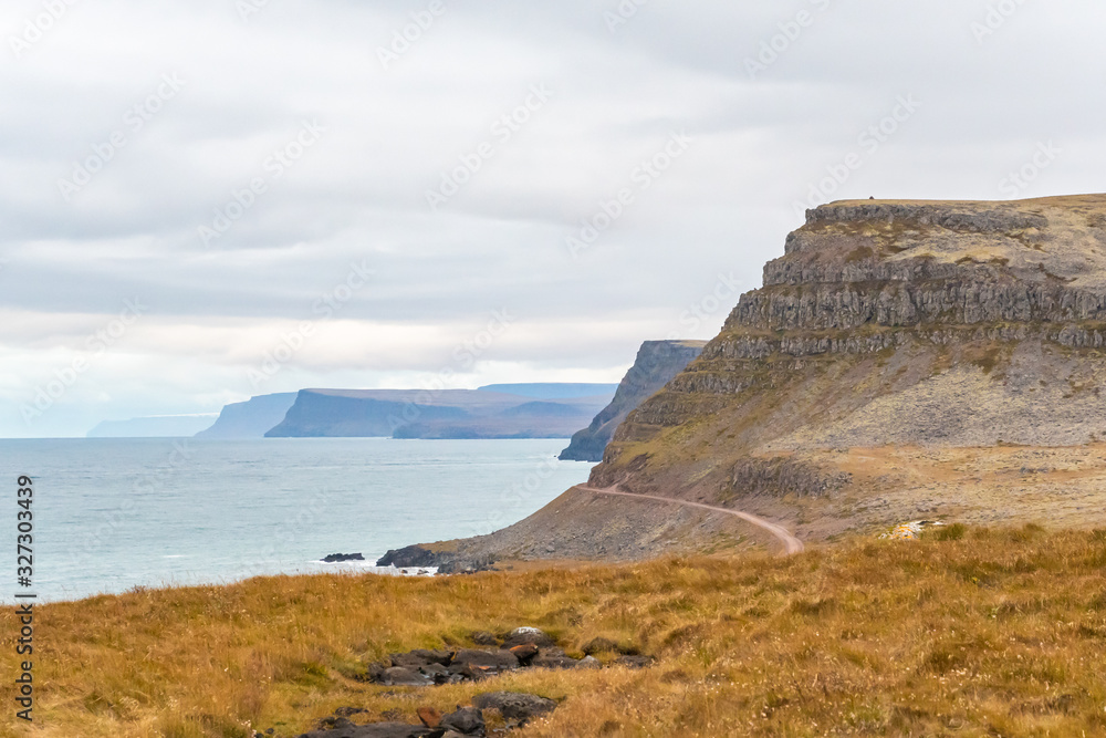 Latrabjarg in Iceland cliff coast unpaved road along steep coast into national park Latrabjarg in Iceland cliff coast unpaved road along steep coast into national park