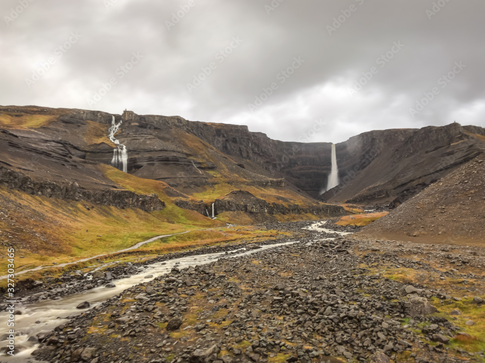 Litlanesfoss and Hengifoss waterfall in east Iceland long exposure during heavy rainfall
