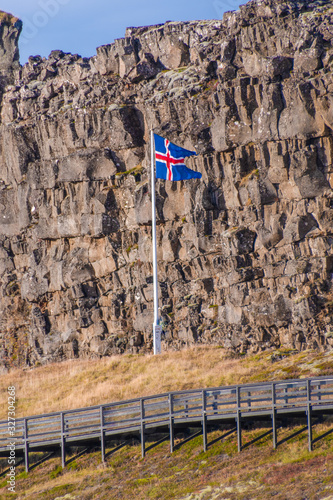 Thingvellir National Park in Iceland icelandic flag in front of Loegberg photo