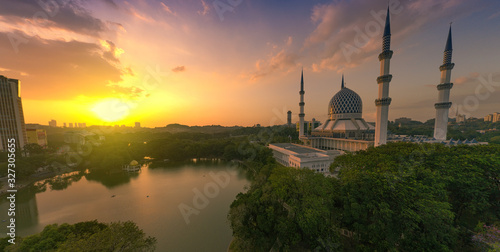 super panorama sunset view aerial shot with mosque and lake in the frame