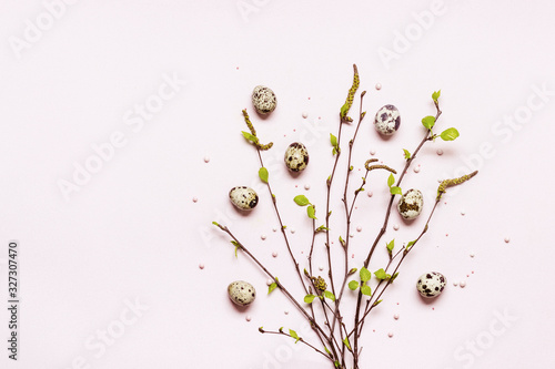 Spring Bouquet of young blooming twigs and quail eggs. Happy easter concept