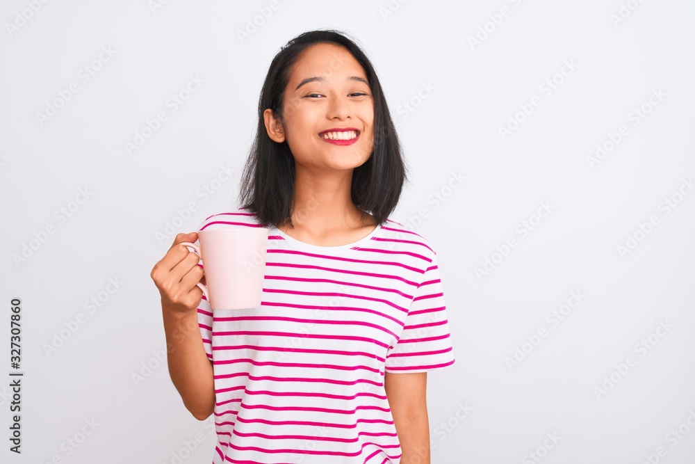 Young beautiful chinese woman drinking cup of coffee over isolated white background with a happy face standing and smiling with a confident smile showing teeth Young beautiful chinese woman drinking cup of coffee over isolated white background with a happy face standing and smiling with a confident smile showing teeth