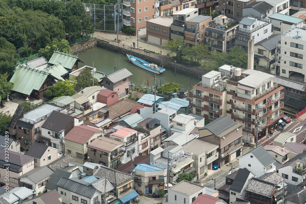 Aerial view of Tokyo suburb with residential buildings and modern skyscrapers Aerial view of Tokyo suburb with residential buildings and modern skyscrapers