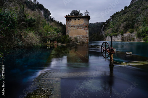 Ancient shipyard and abandoned building on Nera River near Stifone, Narni, Terni, Umbria, Italia photo