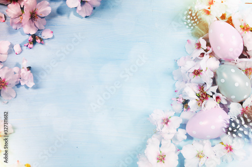 Easter background with Easter eggs and spring flowers.