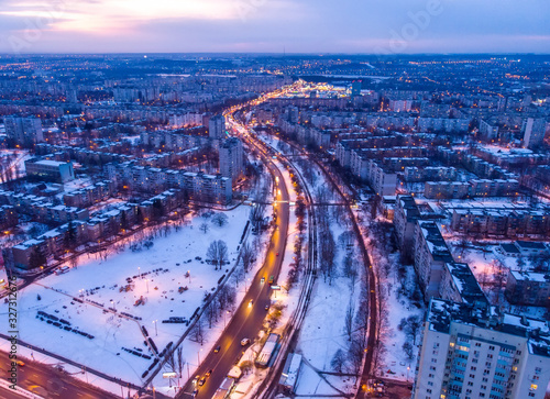 Aerial city winter view with crossroads and roads, houses, buildings, parks. Helicopter drone shot. Wide Panoramic image. Kharkiv, Ukraine © Kotangens