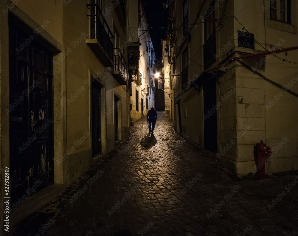 The streets of the old city at night. Alfama District. Lisbon. Portugal.