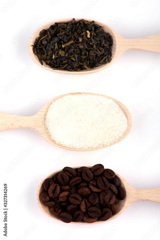 coffee beans in a spoon. tea in a spoon coffee beans in a spoon. tea in a spoon