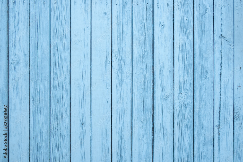 Old painted blue wall textured background, vertical boards Old painted blue wall textured background, vertical boards