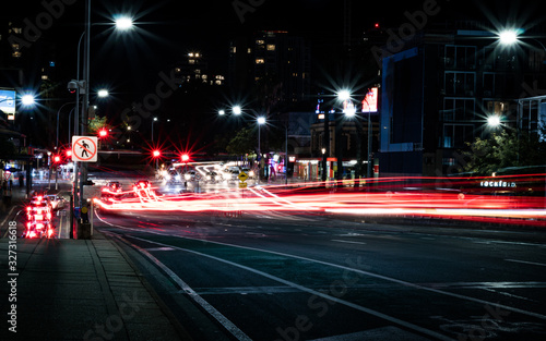 Long exposure light trails of traffic on street at night in city © Jordan