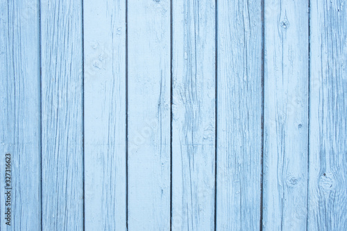 Old painted blue wall textured background, vertical boards