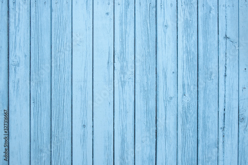 Old painted blue wall textured background, vertical boards