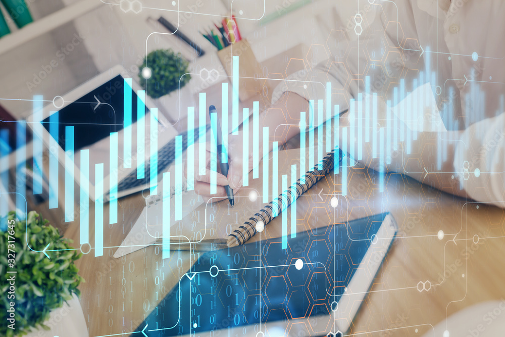 Financial graph displayed on woman's hand taking notes background. Concept of research. Double exposure Financial graph displayed on woman's hand taking notes background. Concept of research. Double exposure