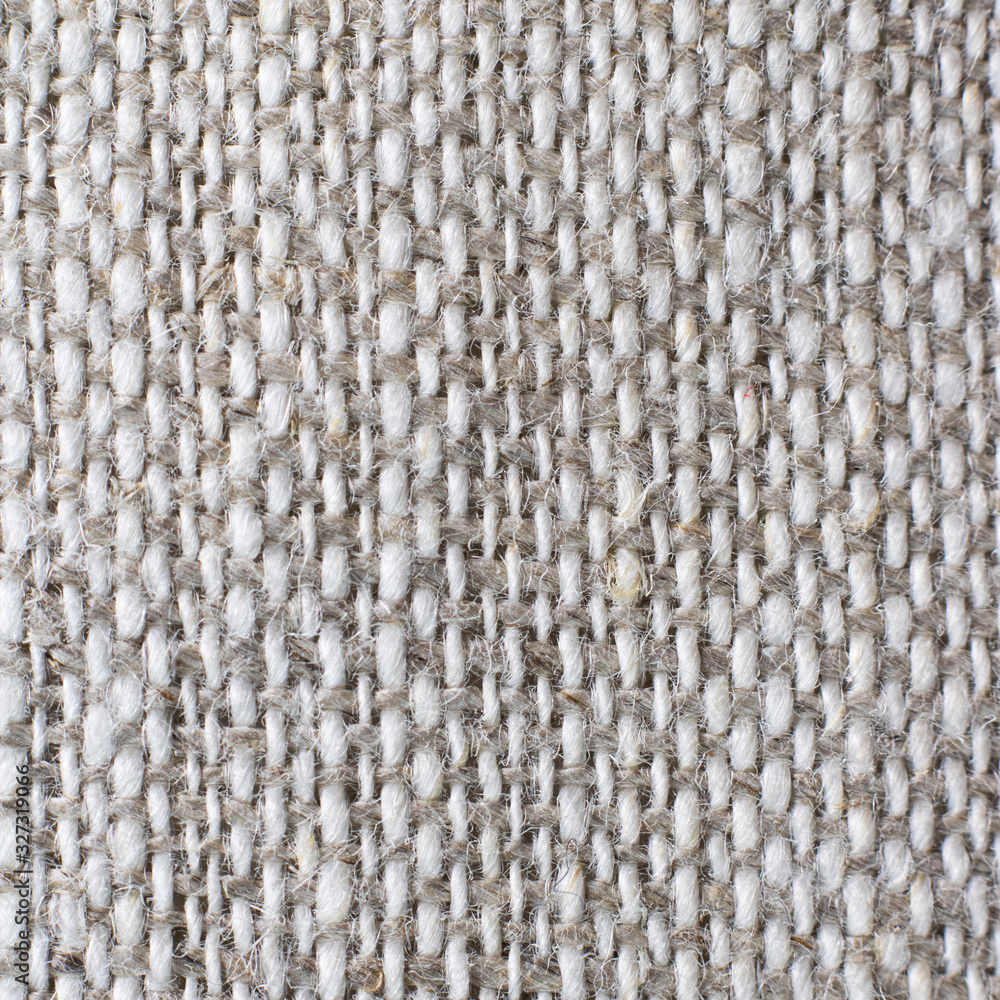 Macro of grey and white natural linen textile background. Square. For text or design Macro of grey and white natural linen textile background. Square. For text or design