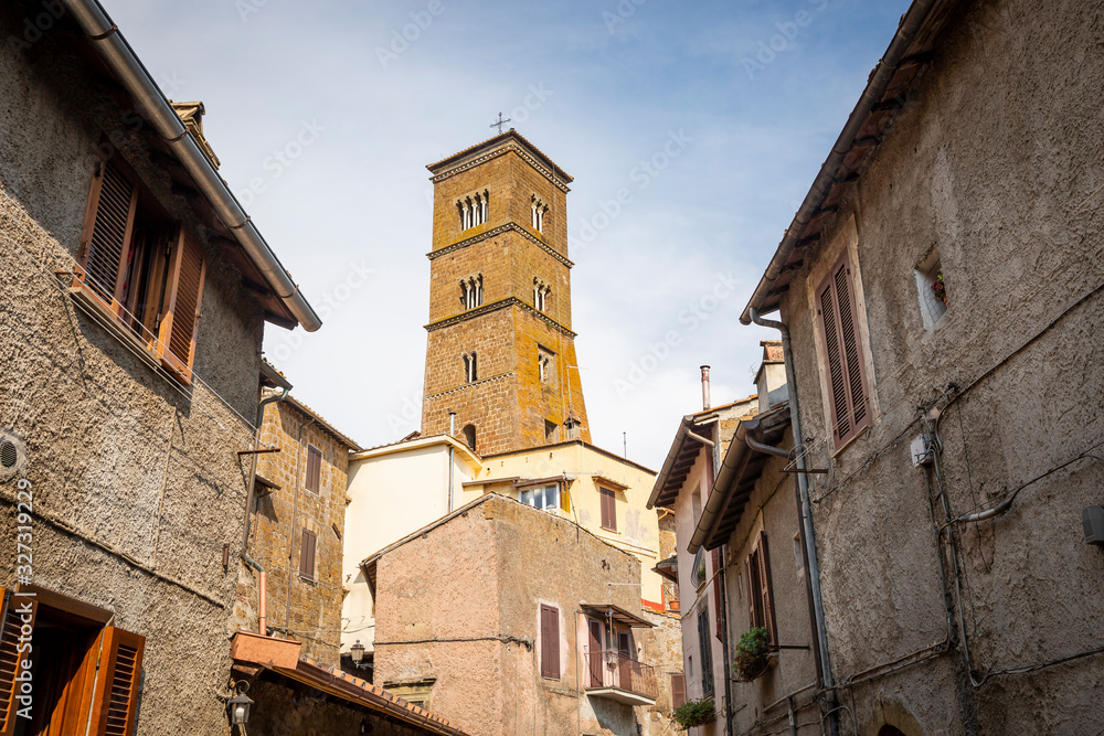 a street in Sutri Ancient town with the tower of the Santa Maria Assunta Cathedral, province of Viterbo, Lazio, Italy