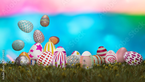 Set of colorful easter eggs on green grass with blurry colorful background © hadkhanong