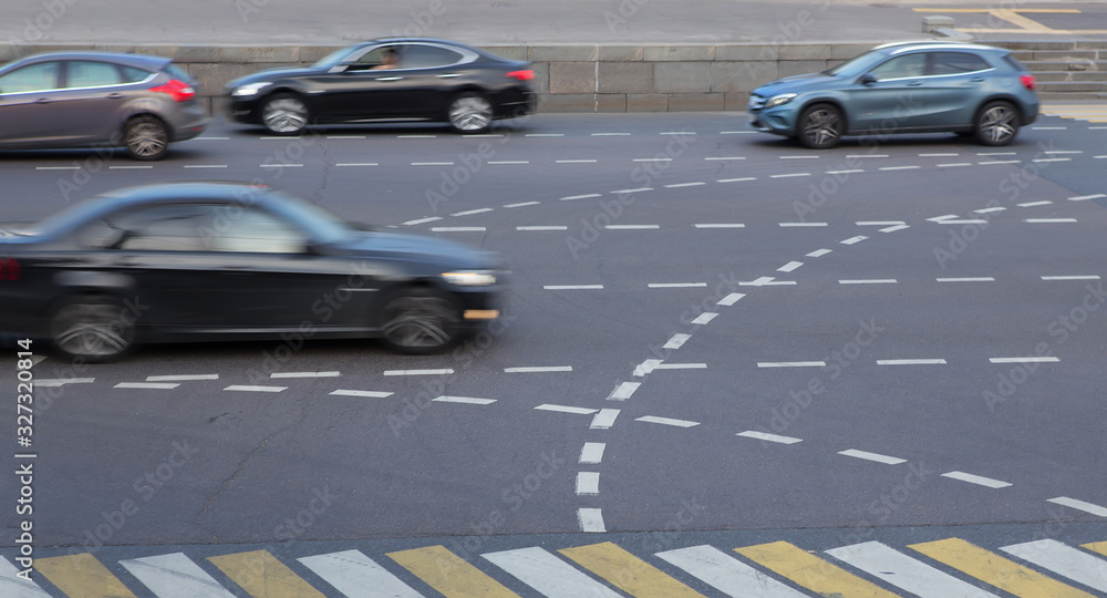 Car traffic on a multi-lane highway in the afternoon. Car traffic on a multi-lane highway in the afternoon.