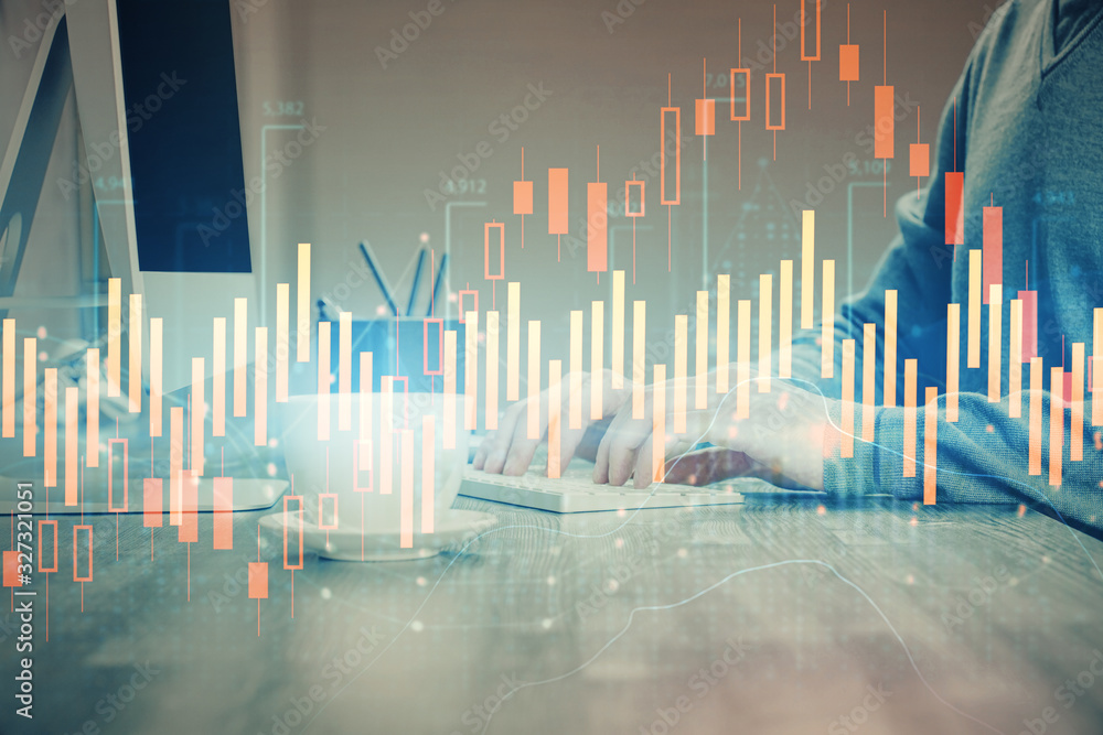 Multi exposure of graph with man typing on computer in office on background. Concept of hard work. Multi exposure of graph with man typing on computer in office on background. Concept of hard work.