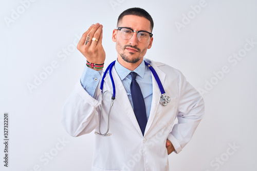 Young doctor man wearing stethoscope over isolated background Doing Italian gesture with hand and fingers confident expression