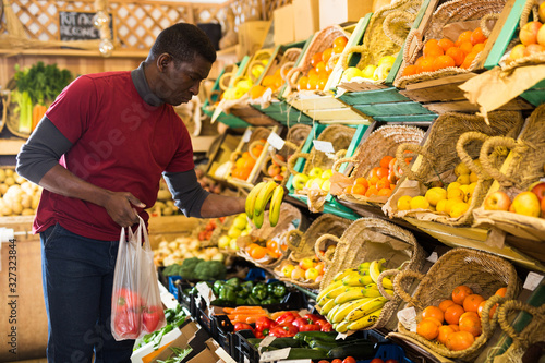 Man shopping in fruits and vegetables store