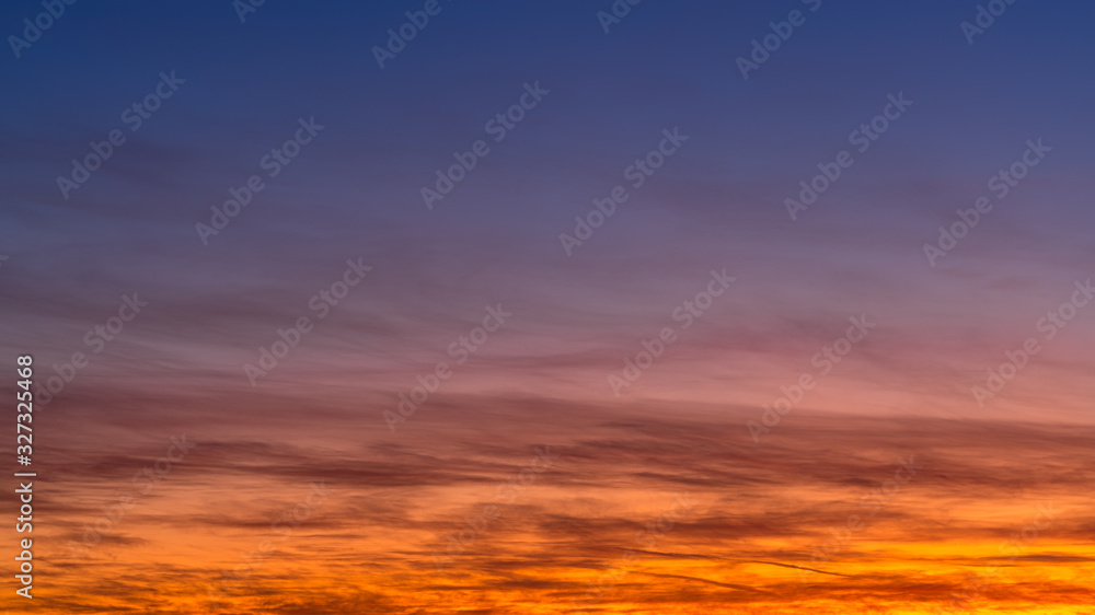 Sunset sky with colored clouds. Abstract background