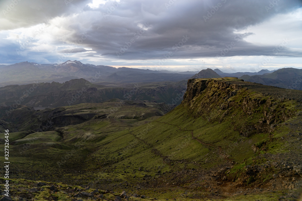 Obraz premium Canyon and Mountain peak during dramatic and colorful sunset on the Fimmvorduhals Hiking trail near Thorsmork
