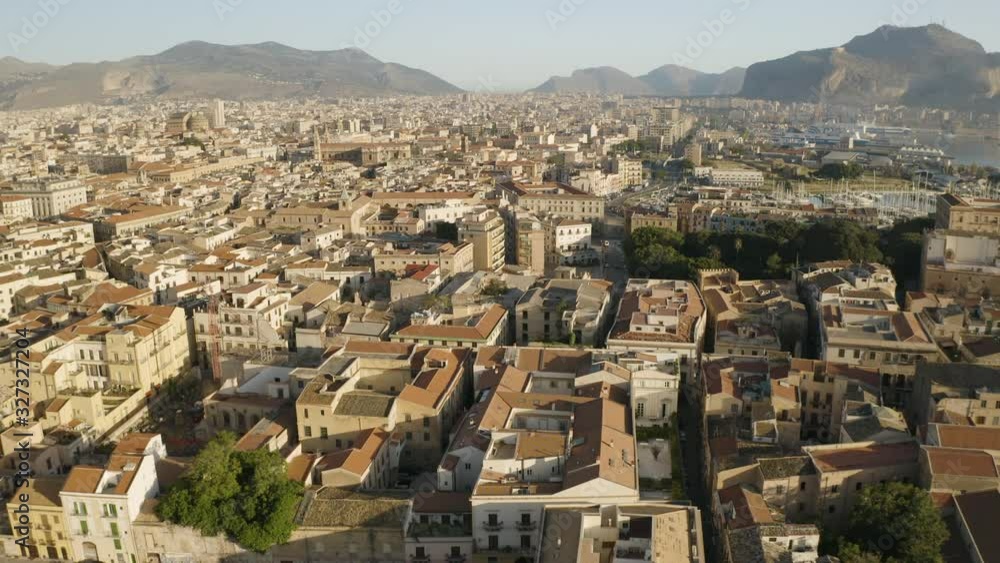 Flight over the historic part of Palermo. Early sunny morning. Mountains in the background. Sicily, Italy. May 2019. Aerial shot Flight over the historic part of Palermo. Early sunny morning. Mountains in the background. Sicily, Italy. May 2019. Aerial shot