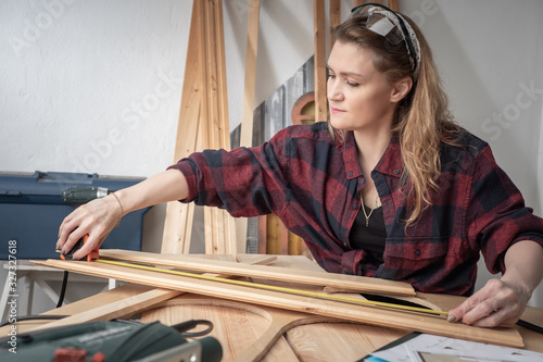 A woman in a plaid shirt in...