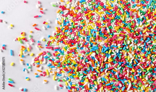 Colorful candy sprinkles on white background