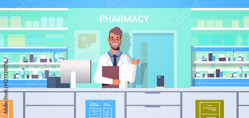 male doctor pharmacist with clipboard standing at pharmacy counter modern drugstore interior medicine healthcare concept horizontal portrait vector illustration