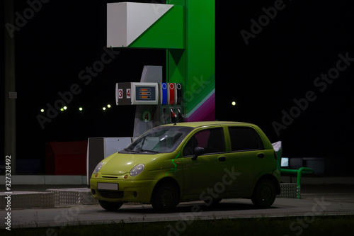 car at a gas station at night