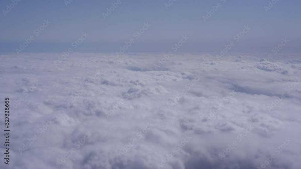 Above the cloud view from airplane window Above the cloud view from airplane window