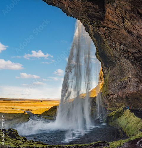 Seljalandfoss waterfall in sunny autumn day  Iceland. Famous tourist attraction