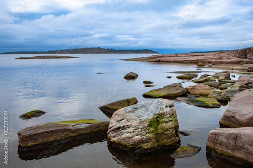 Russia. Karelia. Panorama of lake Ladoga on a cloudy day. Rocky Islands in lake Ladoga. Karelian skerries. Northern nature. Sights Of Russia. Travel to Karelia.