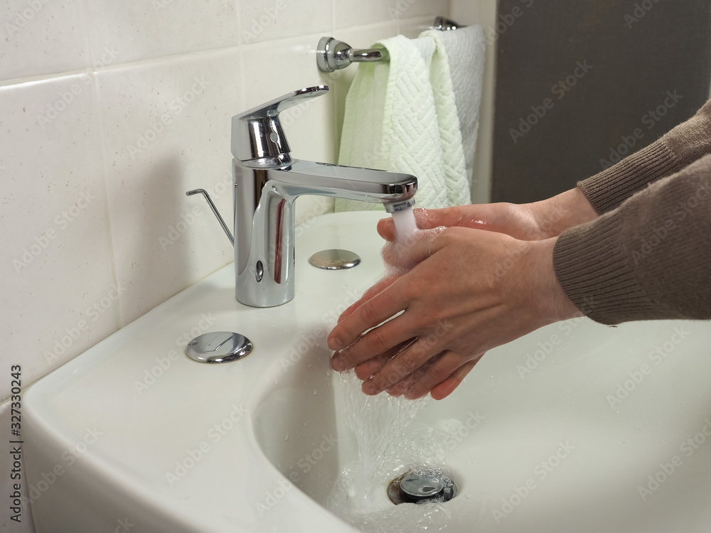 Unrecognisable man washing hands Unrecognisable man washing hands