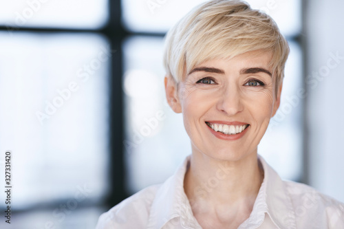 Portrait Of Happy Businesswoman Posing In Modern Office