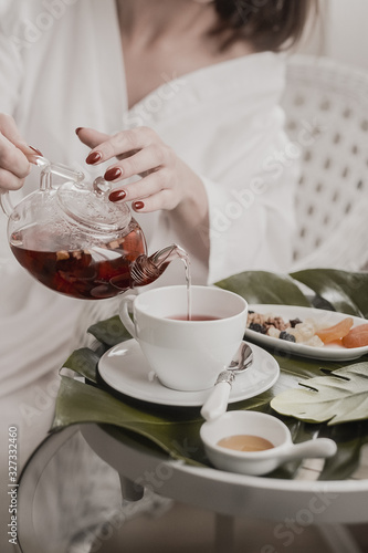 woman with cup of coffee and cake