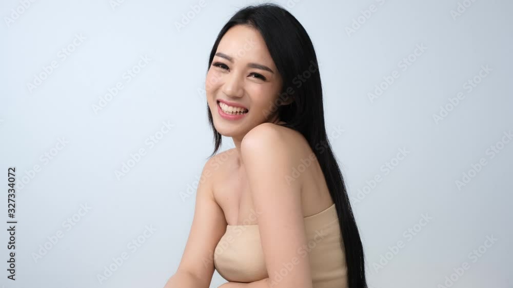 Portrait of beautiful woman with happy emotion at white background. People with beauty, healthy, fashion concept.Attractive Asian woman tossing her long.4k resolution. Portrait of beautiful woman with happy emotion at white background. People with beauty, healthy, fashion concept.Attractive Asian woman tossing her long.4k resolution.