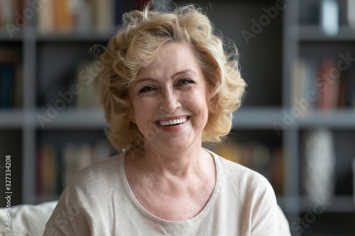Portrait of happy mature woman relaxing at home Free Download Portrait of happy mature woman relaxing at home - GFXLoad