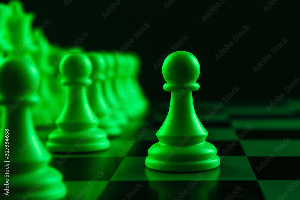 Close-up white pawn on a chessboard, chess, game. The concept of confrontation, career, promotion, startup. Close-up white pawn on a chessboard, chess, game. The concept of confrontation, career, promotion, startup.