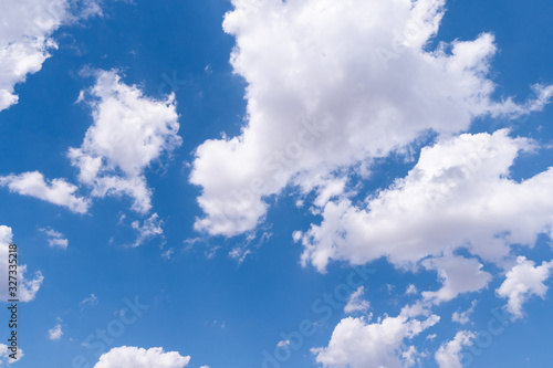 The blue sky with moving white clouds. The most of clouds are beautiful color and shade  suitable for use as background image.