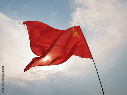 Image of the red USSR flag with hammer and sickle. Celebration of the Victory Day (May 9)  in the Victory Park (Park Pobedy) on Poklonnaya Hill in Moscow. 