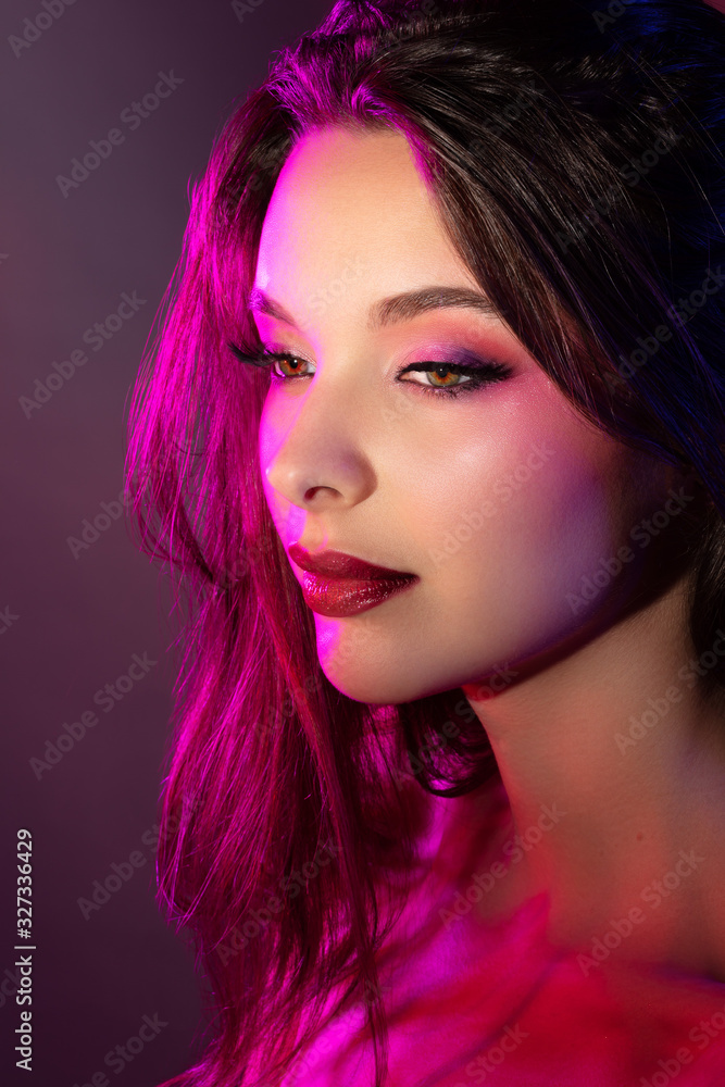 Fototapeta premium Colorful portrait of a pretty young sensual woman