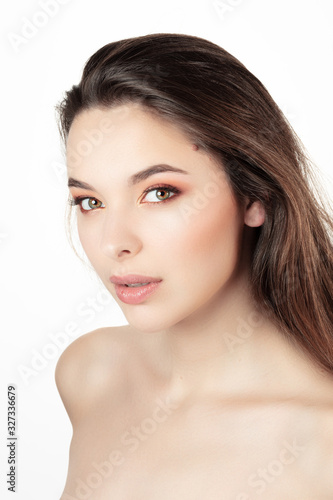 Portrait of an attractive young woman under white background