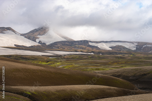 Beautiful landscape with glacier, hills and moss on the Fimmvorduhals trail near Landmannalaugar of summer sunny day, Iceland