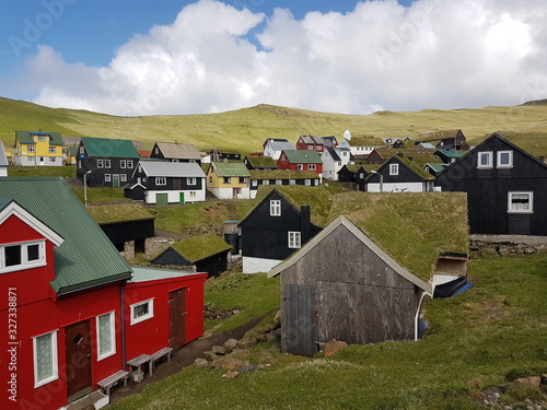 grassy rooftops rural village mykines faroe islands photo